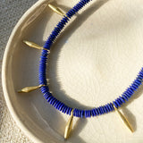 Lapiz and golden bead necklace