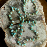 An image of a Peruvian Opal Necklace with gold and blue details